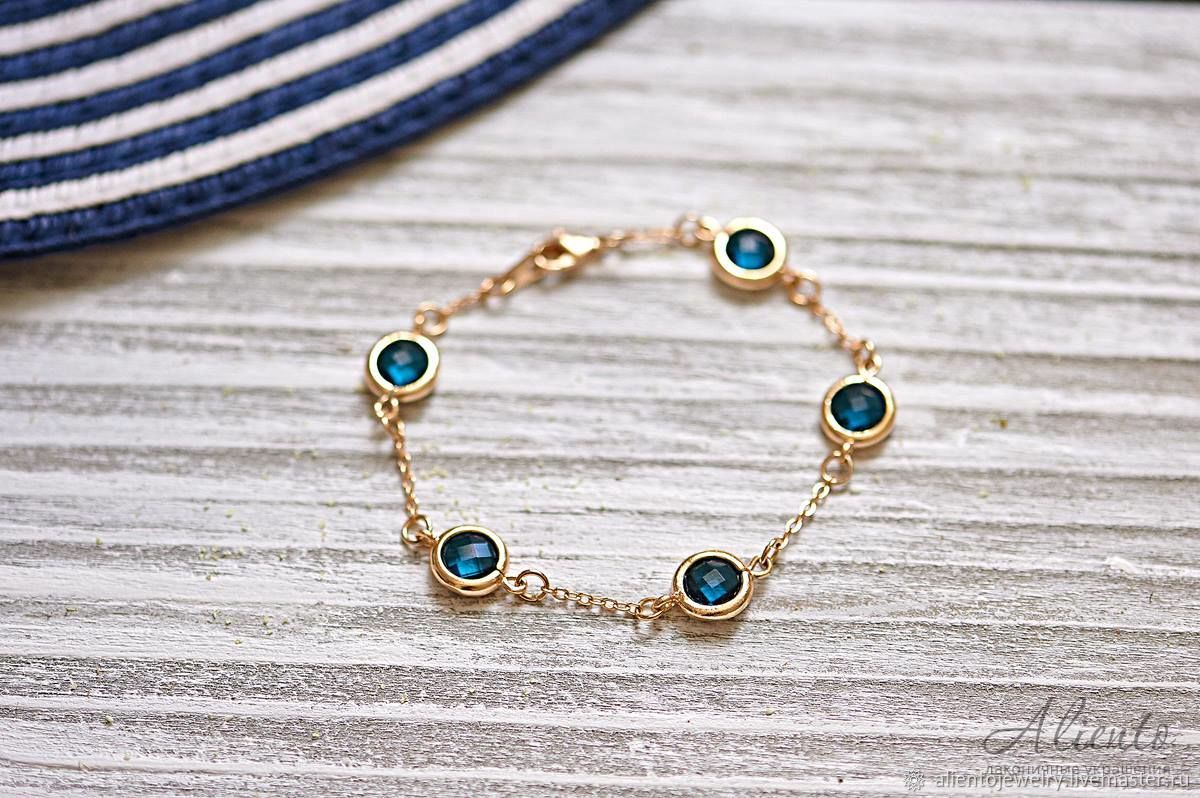 Позолоченный браслет с синими кристаллами "Сапфир"